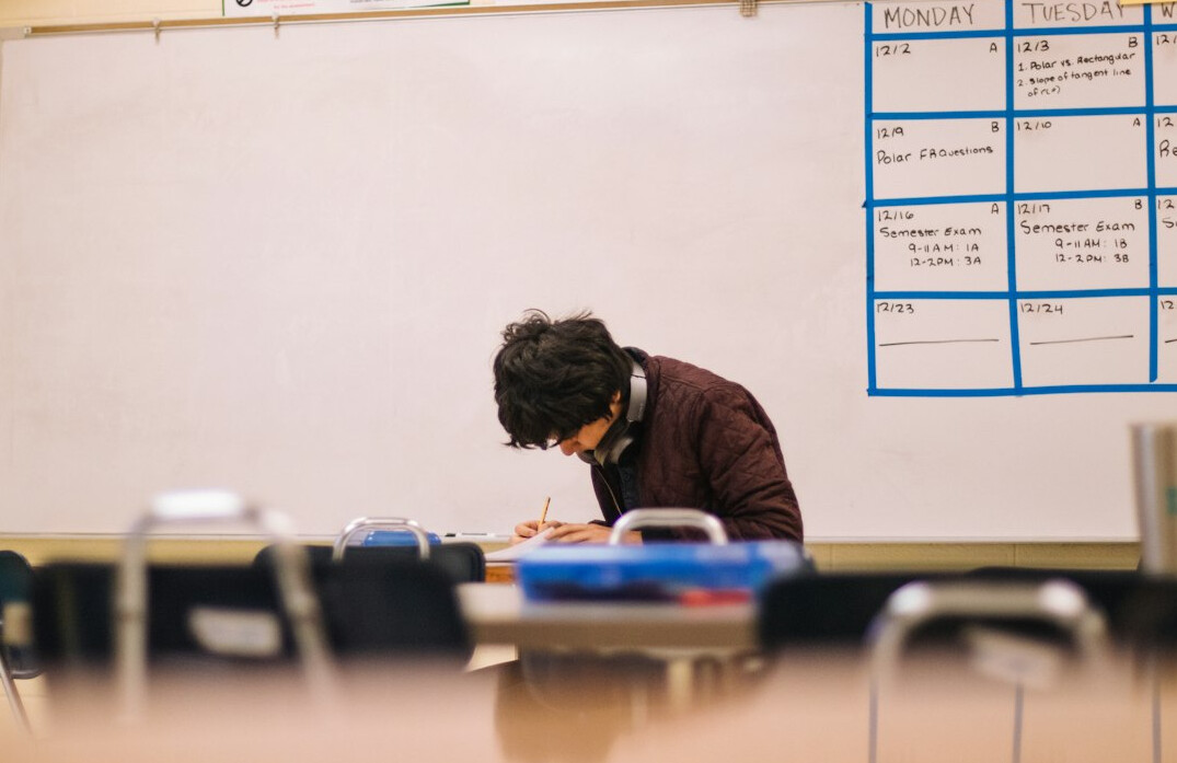 student meditating in classroom