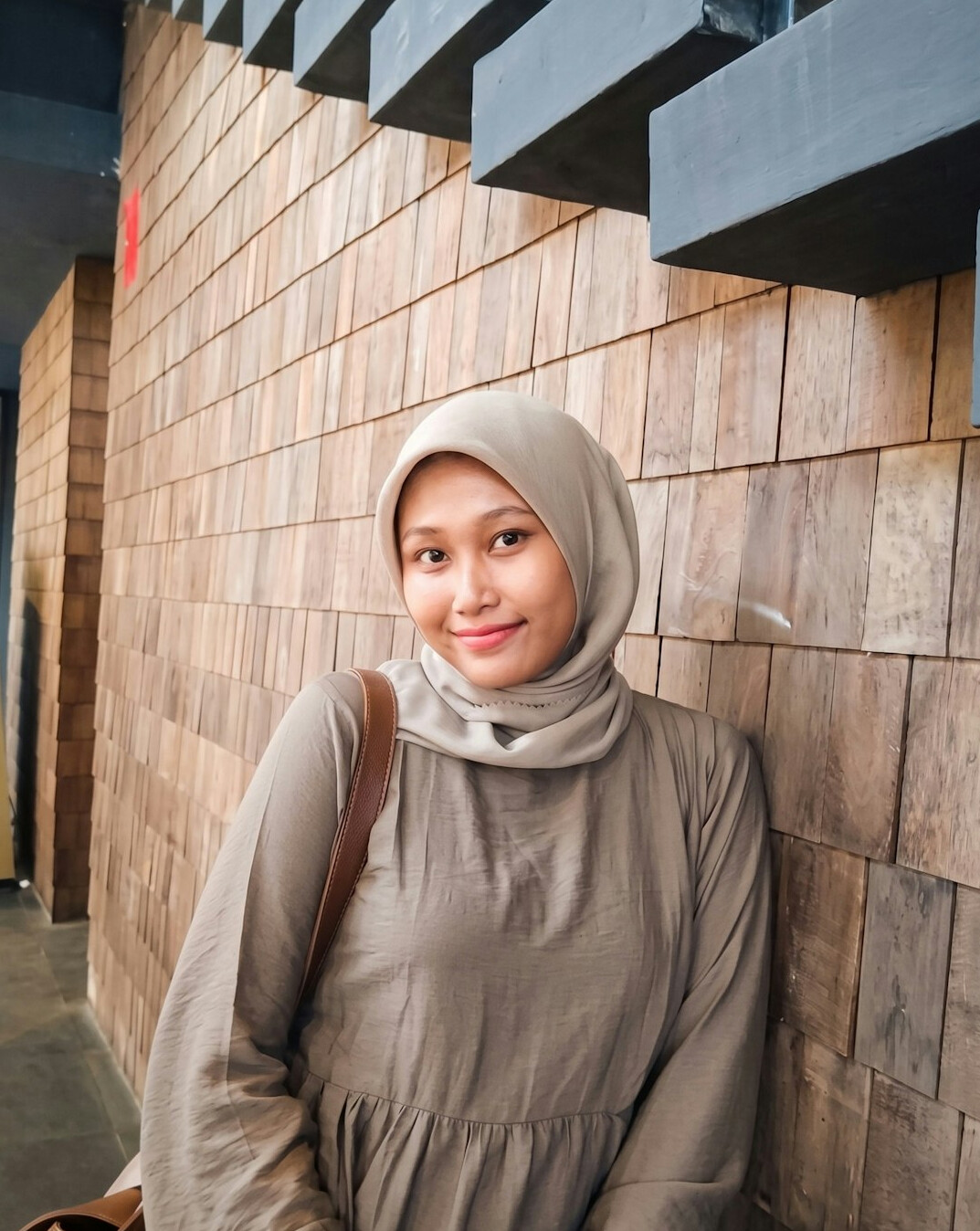 Smiling Malay Singaporean woman in smart casual wear