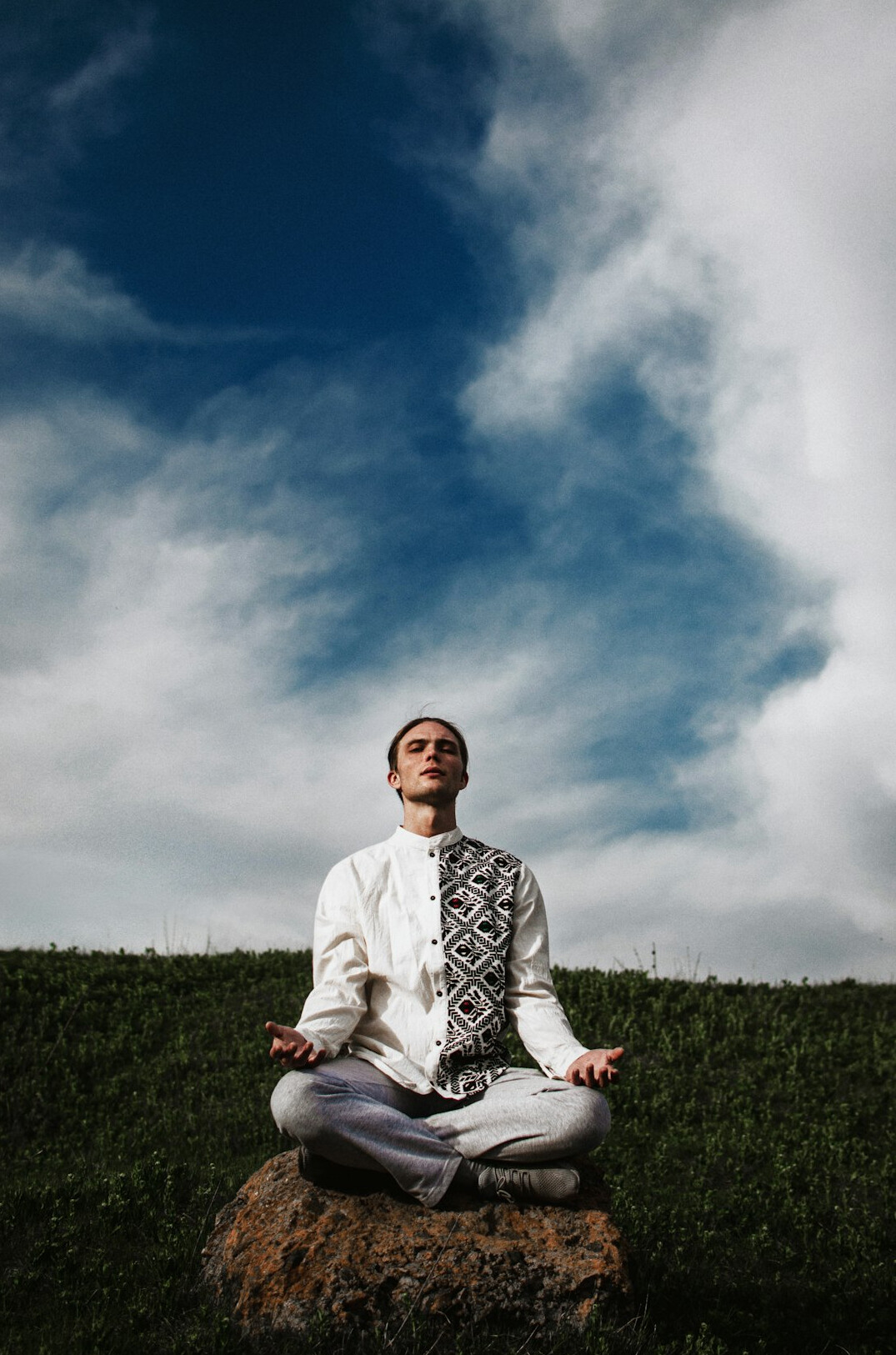 person meditating in nature