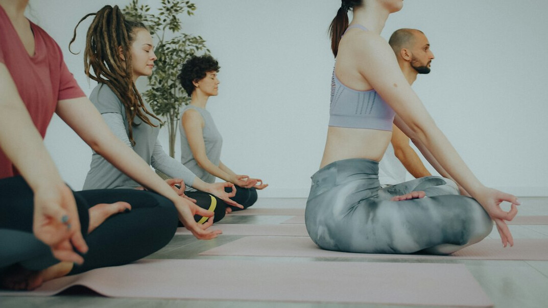 Small group meditating together indoors